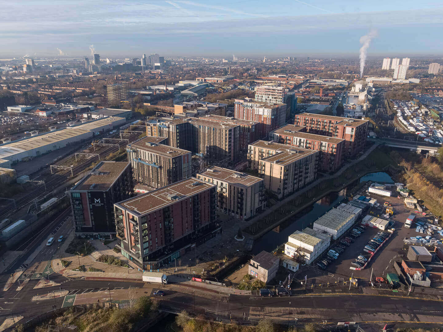 Aerial drone survey photographing brickwork quality at Middlewood Locks construction development, Salford