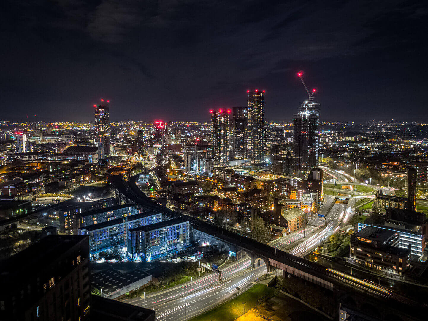 Night time aerial drone photography of Renaker developments in Manchester