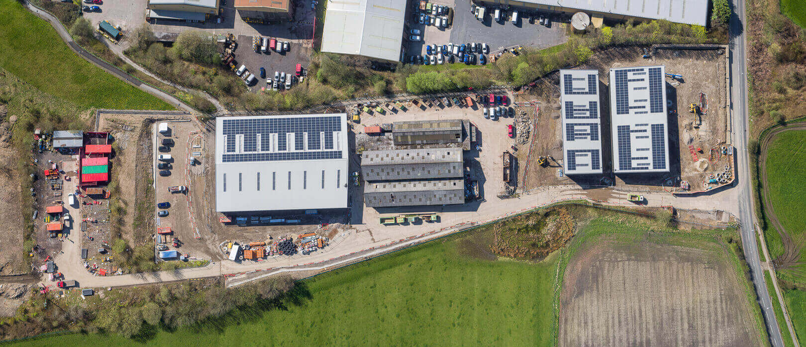Aerial drone photography of construction progress at Top Deck industrial development, Bolton