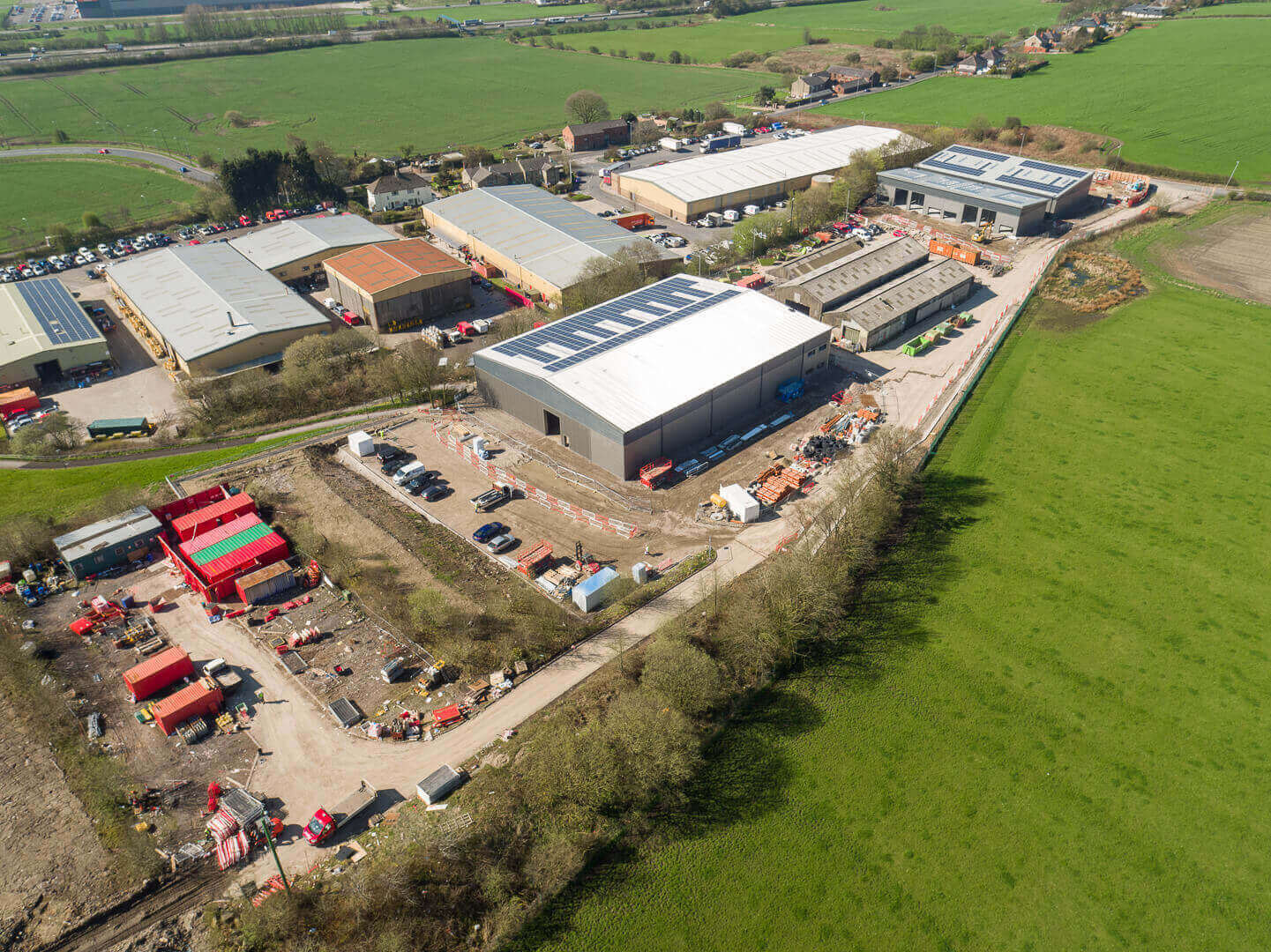 Aerial drone photography of construction progress at Top Deck industrial development, Bolton