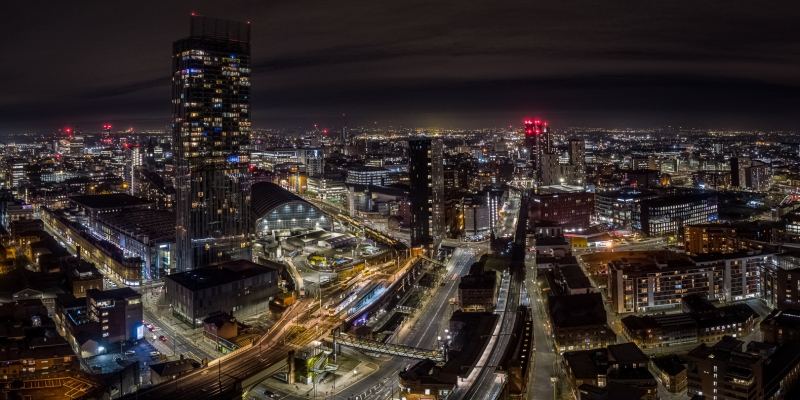 Aerial panoramic photograph of Manchester City centre at night including Beetham Tower, Deansgate Station, AXIS Tower, First Street & Manchester Central