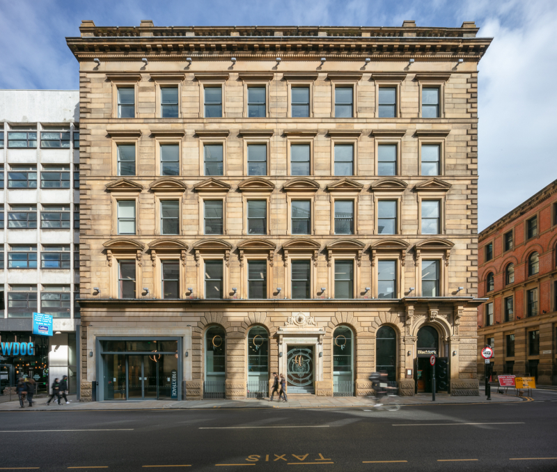 The stone built facade of Freetrade, Manchester taken on a sunny day - Midi Photography